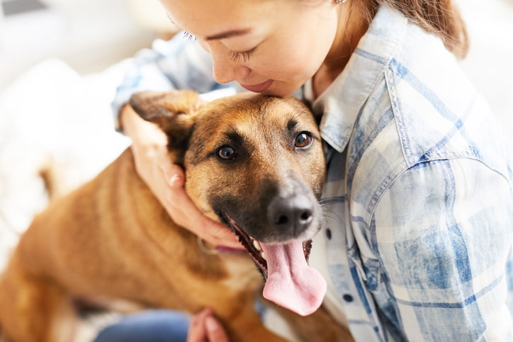 woman and her dog bonding